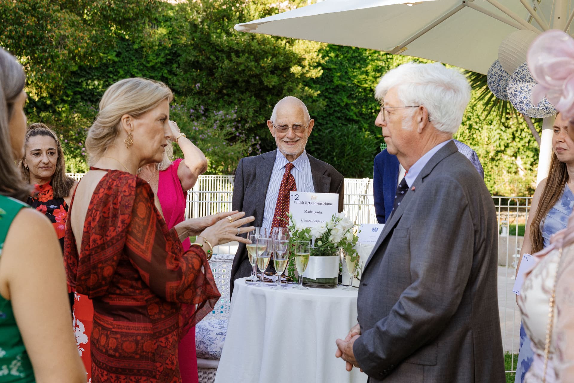 Residents and guests gathered outdoors at The British Retirement Home