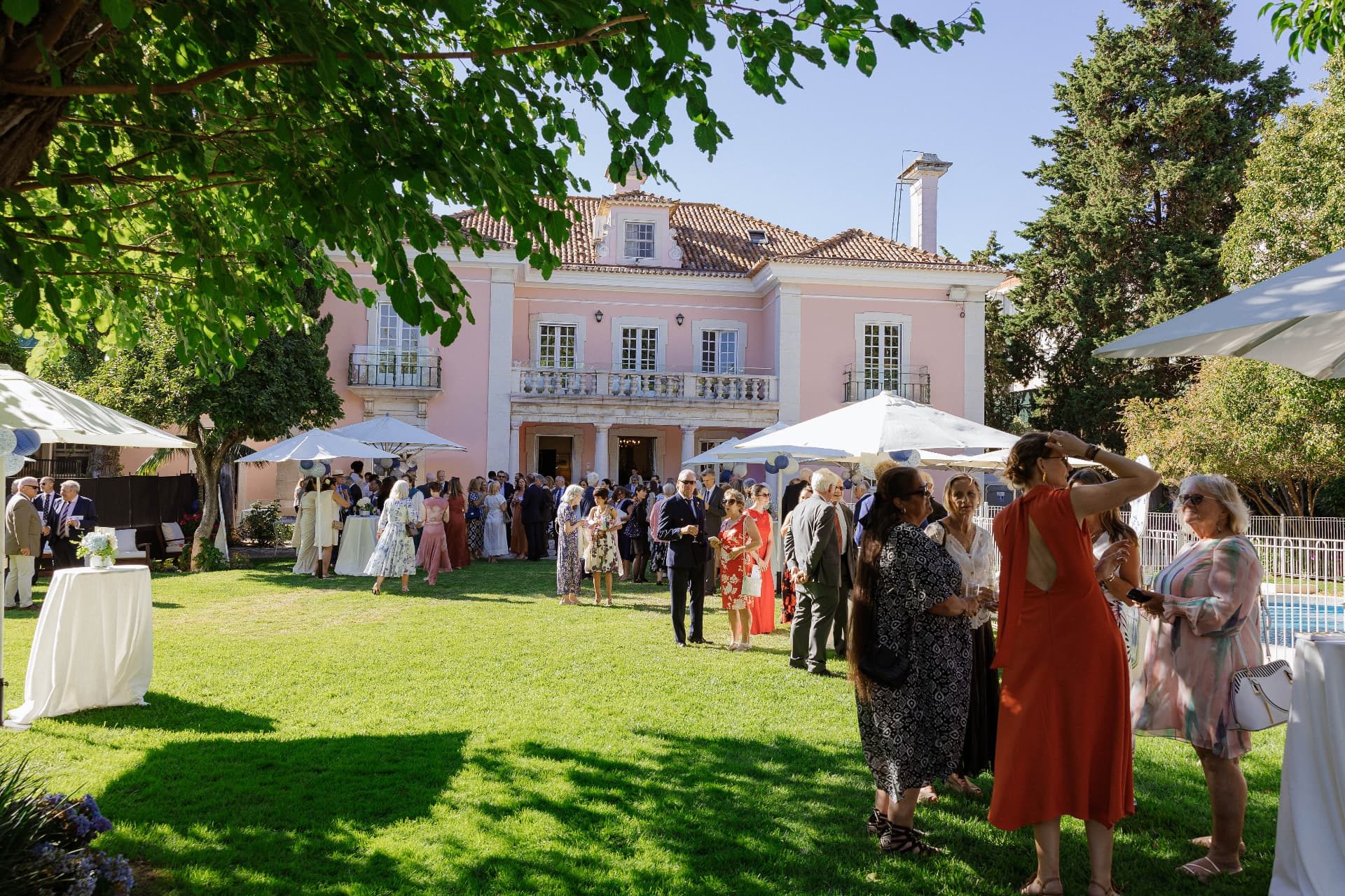 A garden party on the lawn in front of the residence