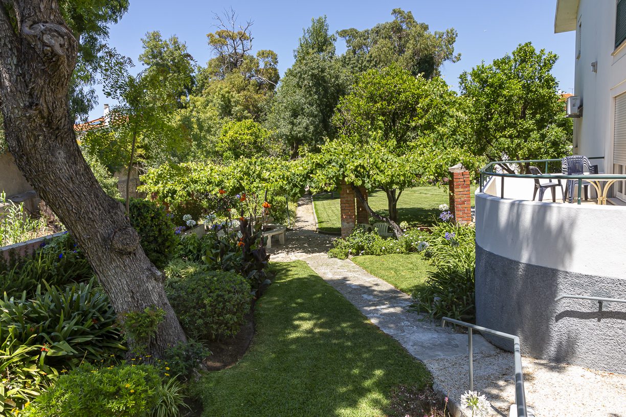 A garden path leading through the grounds of The British Retirement Home
